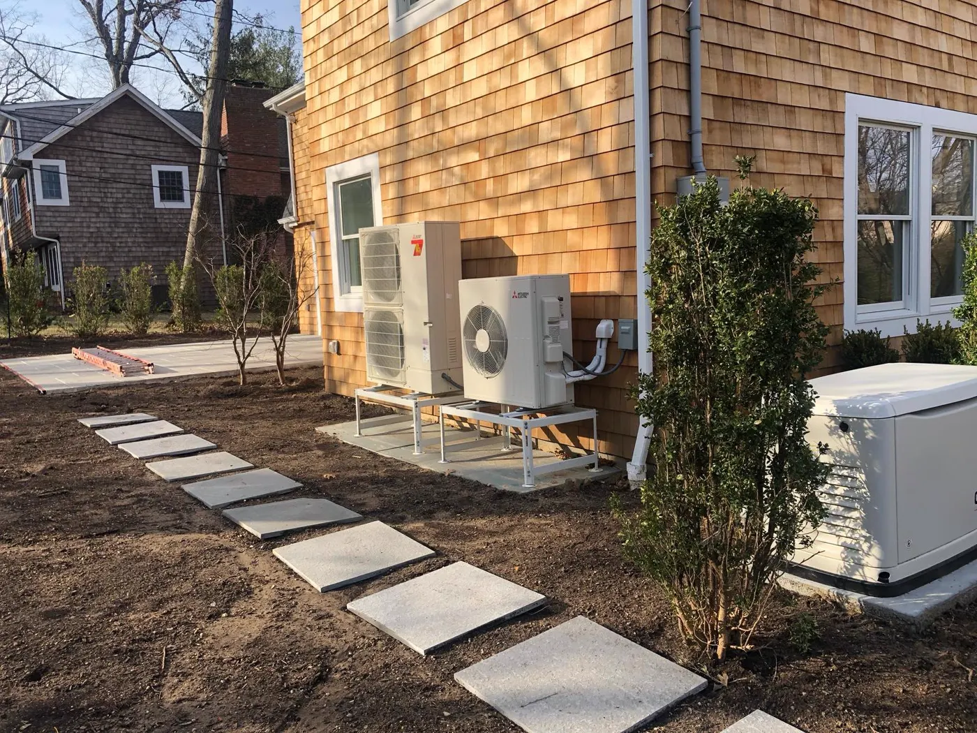 Outdoor HVAC installation beside a residential building